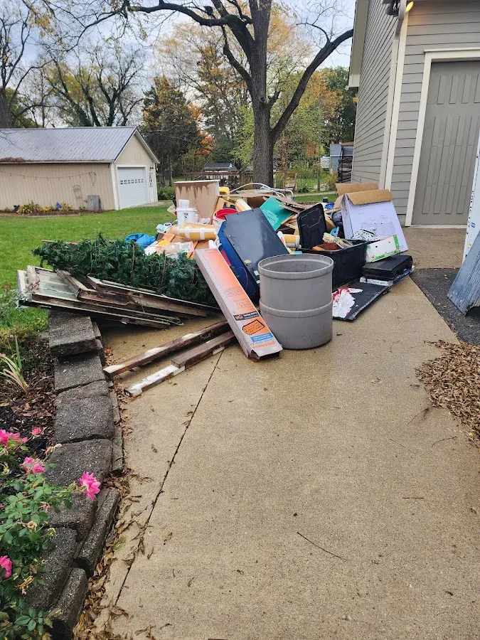Dumpster being loaded with debris for 3 Yard Dumpster Rental in Rincon Valley